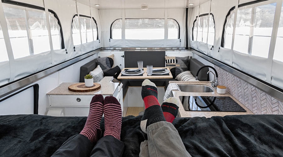 EarthCruiser Terranova Interior bed, dining and kitchen, pop-up roof